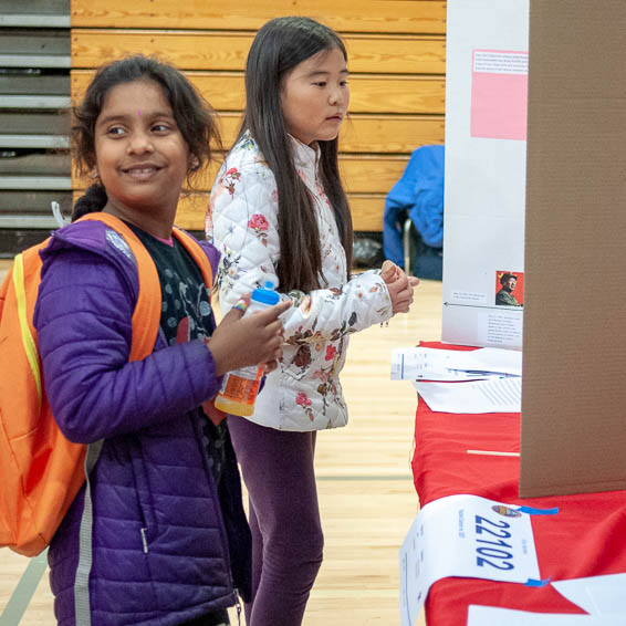 Two students looking at project display