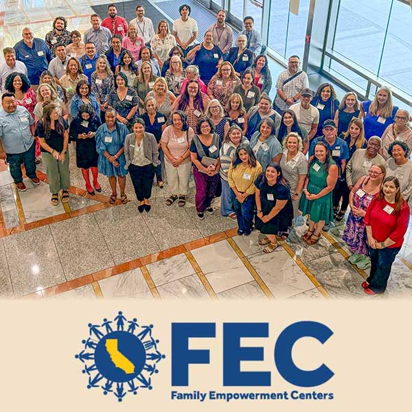 Large group of people posing in the CDE lobby