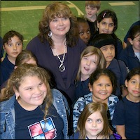 Cheryl Fox Dultz surrounded by some of her third grade students