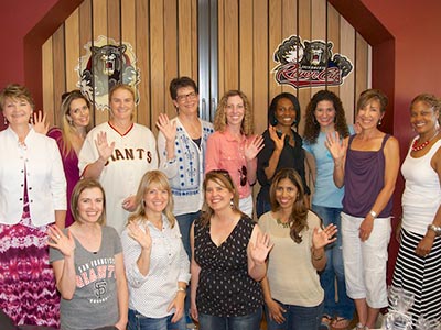 Sacramento County Teachers of the Year standing in a River Cats suite