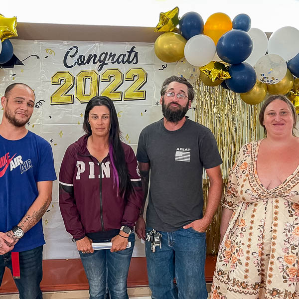 Clients posing in front of balloons