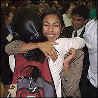 Smiling students hugging