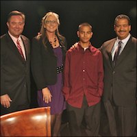 Anthony Ochoa standing with members of discussion panel