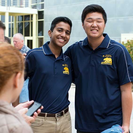 Students posing wearing History Day polo shirts