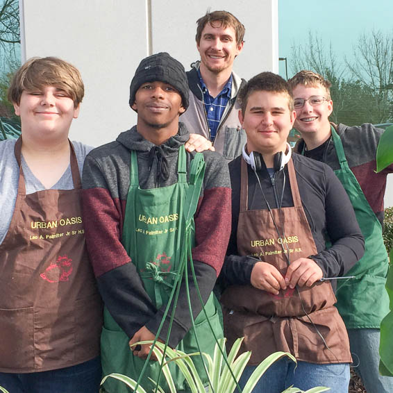 Students wearing Palmiter Urban Oasis aprons