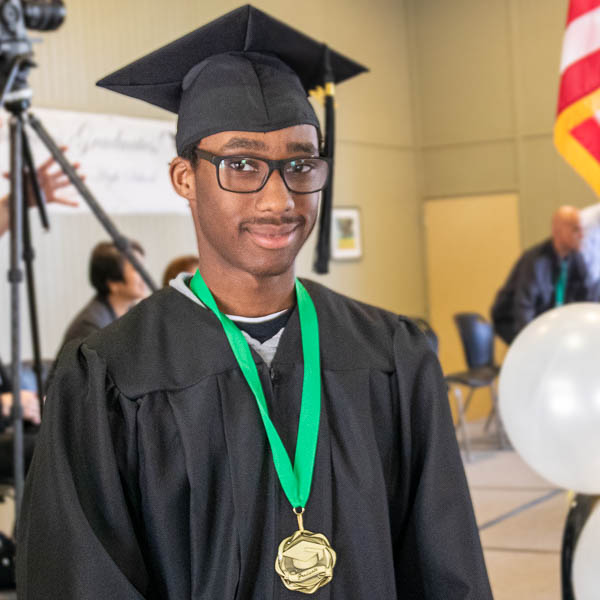 Graduate wearing cap and gown