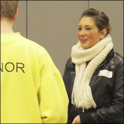 Employer representative talks with students