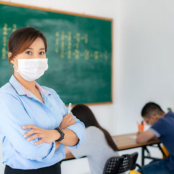 Teacher wearing mask in classroom