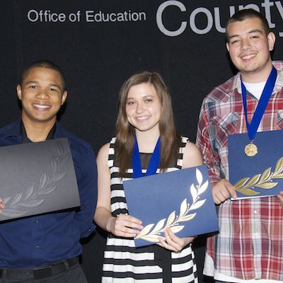 Students holding certificates