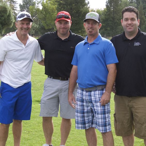 Golfers posing on course