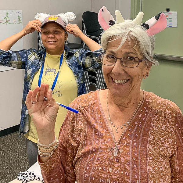 Participants posing in silly hats