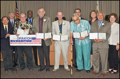 Operation Recognition diploma recipients holding diplomas