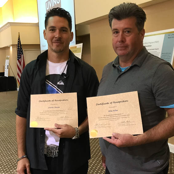 Graduates holding certificates