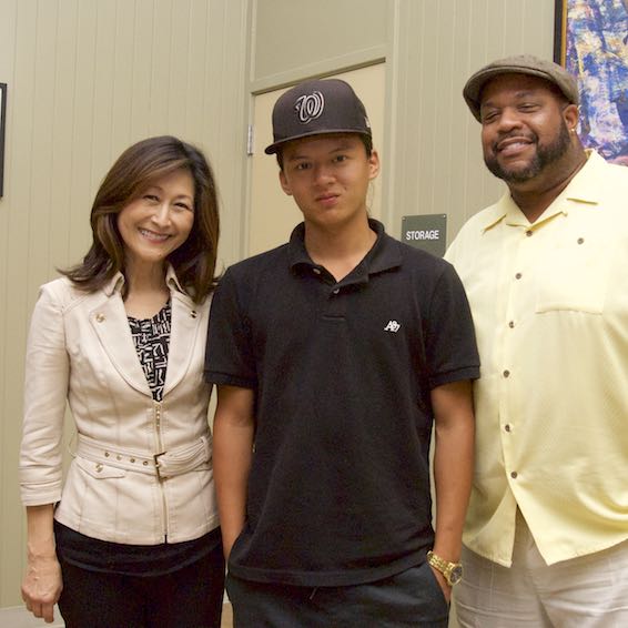 Student posing with advisors