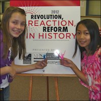 Students with History Day sign