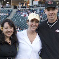 Sylvia Rodriguez and Janet Anderson with River Cats catcher