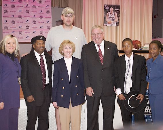 Group posing with Greg Ostertag