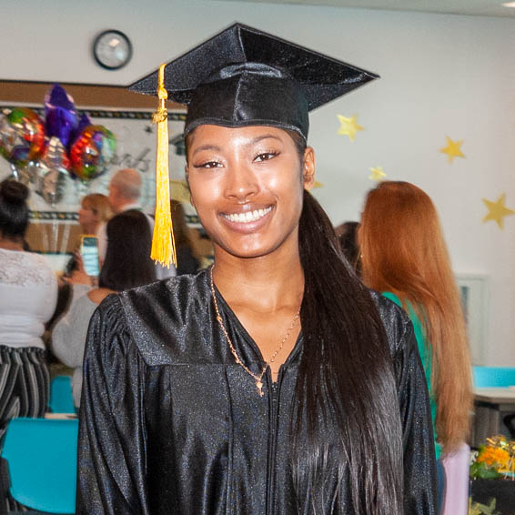 Graduate wearing cap and gown