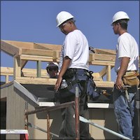 Students in hard hats standing on scaffolding