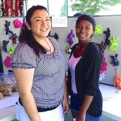 Students selling cat toys