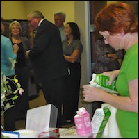 Employee pouring milk