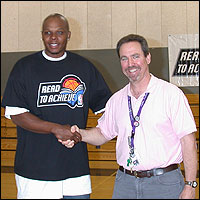 Bonzi Wells and Tom Funk shake hands