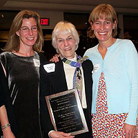 Francie Tidey posing with plaque