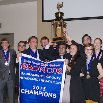 Bella Vista team raising banner and trophy