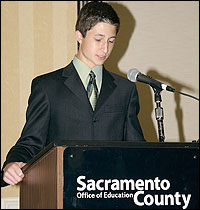 Student speaking at podium