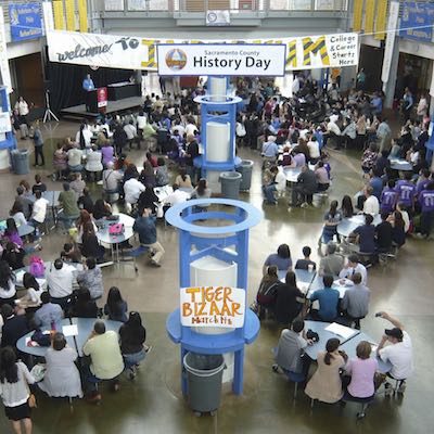 Overhead view of students seated in school common area