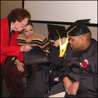 Graduates receive their diploma