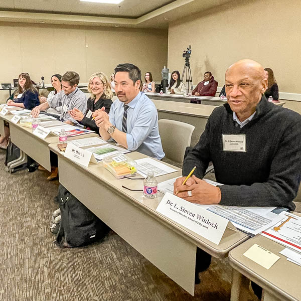 Judges seated at tables