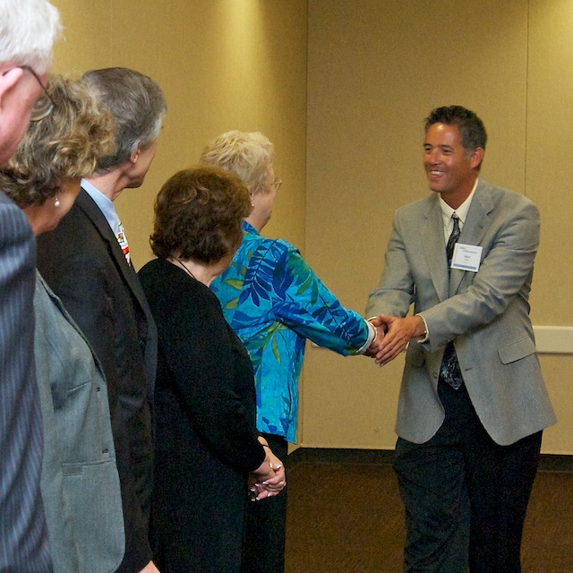 Graduate shaking hands