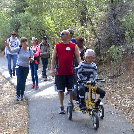 Students on trail using assistive MOVE equipment