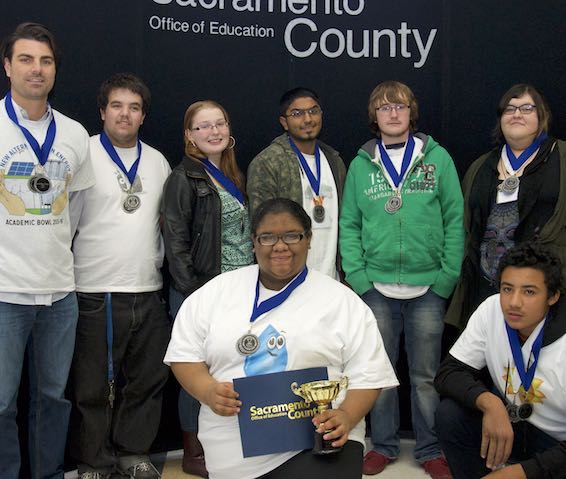 Academic Bowl team holding trophy