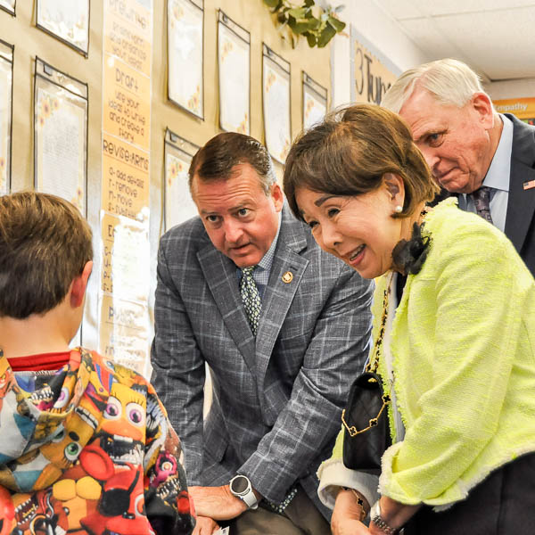 Doris Matsui, and Dave Gordon talking to a student