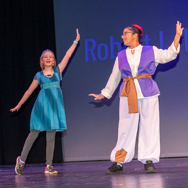 Costumed students performing