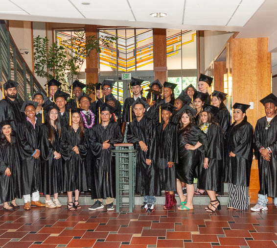 Graduates posing in caps and gowns