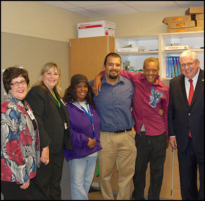 Robin Pierson, Lauren Roth, René Delgado, and David Gordon posing with students