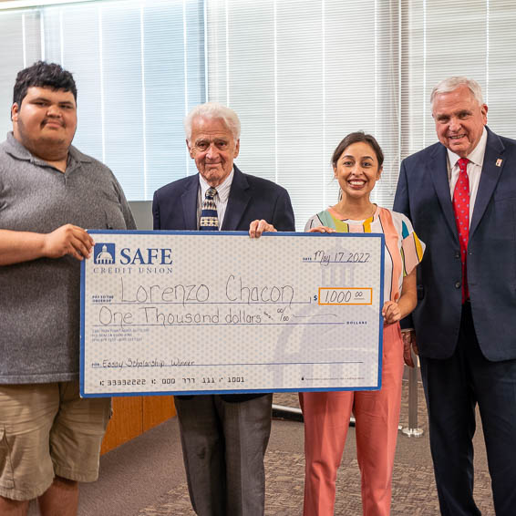 Lorenzo Chacon receiving giant check