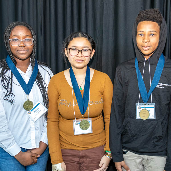 Students posing with medals