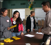 Students pick up information brochures