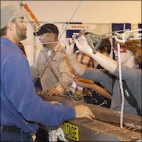 Students try splicing an electric cable