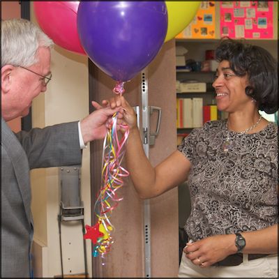 Dave Gordon presenting balloons to Terri Edinburgh