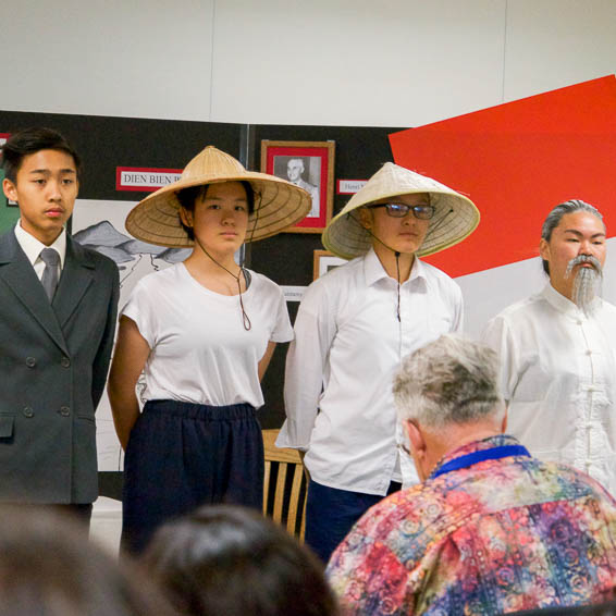 Students wearing Asian style hats