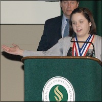 Brooke Bischoff speaking at podium