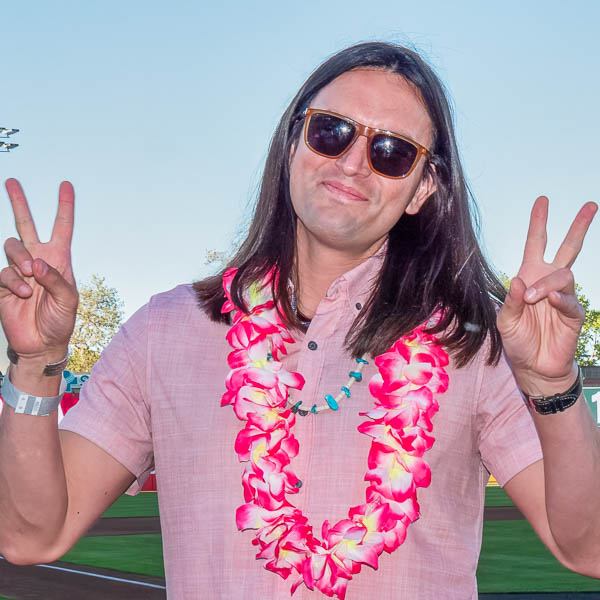 Teacher giving double peace signs