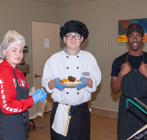 Students preparing to serve food