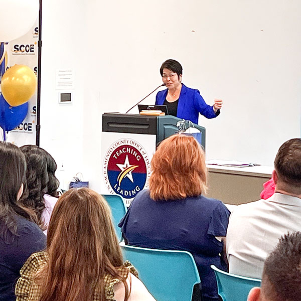 Nancy Herota speaking to audience