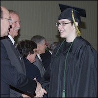 Graduate shaking hands